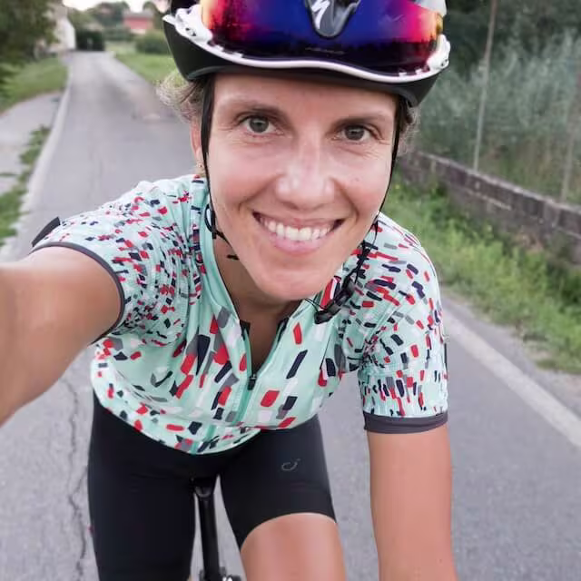 Female cyclist taking a selfie.
