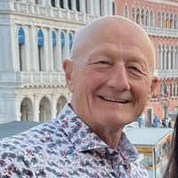 Older bald man smiling